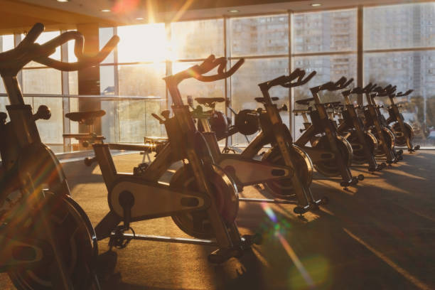 istock Modern gym interior with equipment, fitness exercise bikes 638902880