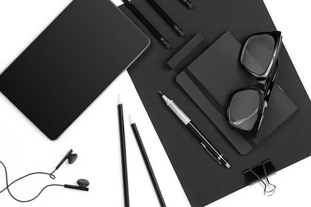 istock Blank notepad with clips, pens and glasses flat lay. 638902906