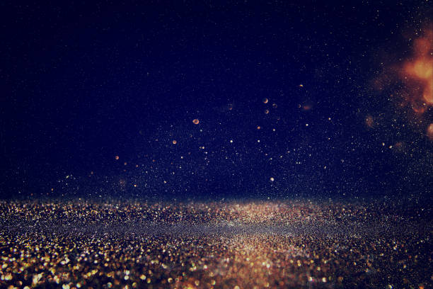 istock glitter lights background. gold, blue and black 638903176