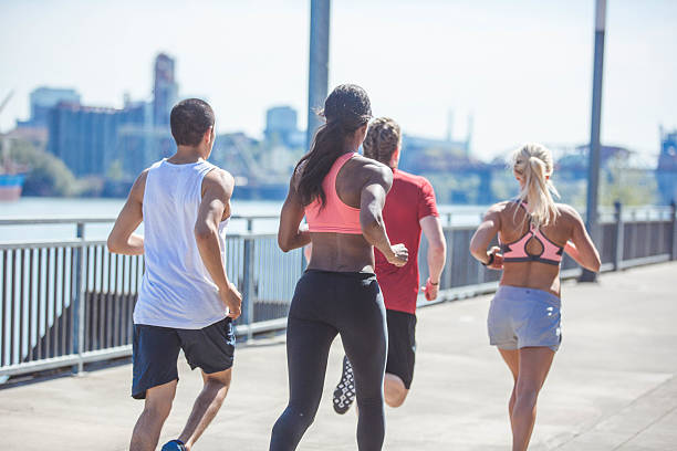 istock A group of diverse athletes running in the city 638903652