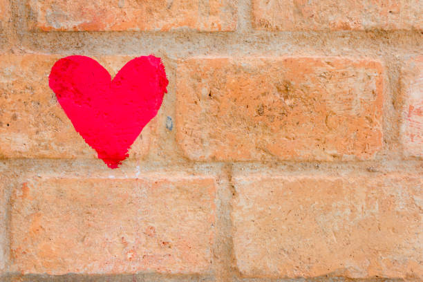 istock Red heart draw on brown brick wall background 638903692