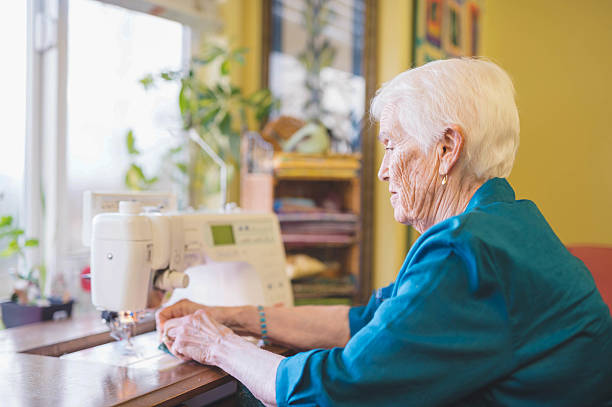 istock An elderly women sewing inside of her sewing room 638903758