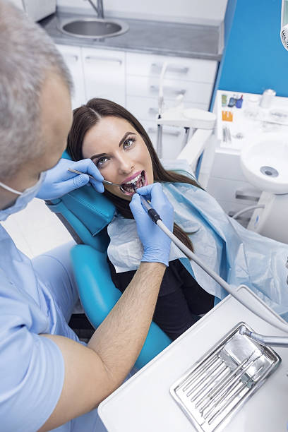 istock Young Woman At The Dentist 638903998