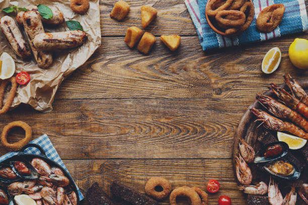 istock Seafood platter top view, flat lay on wooden table background 638906346
