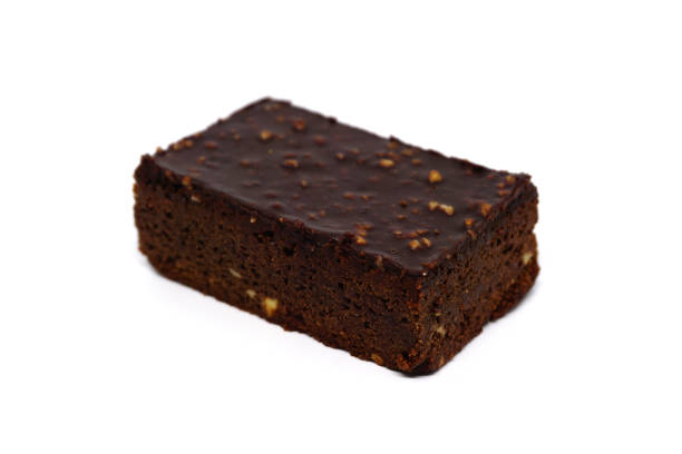 almond chocolate brownie on white background - healthy eating macro close up nut imagens e fotografias de stock