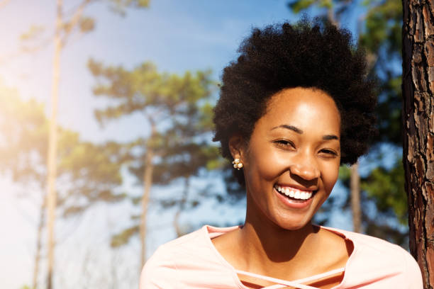 istock Happy young african woman standing outdoors and smiling 638909918