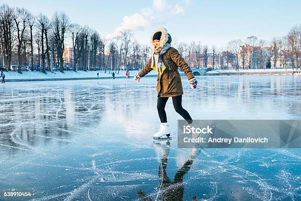 Ice Skating On The Frozen Lake Stock Photo - Download Image Now - Ice-skating, Lake, Ice Rink