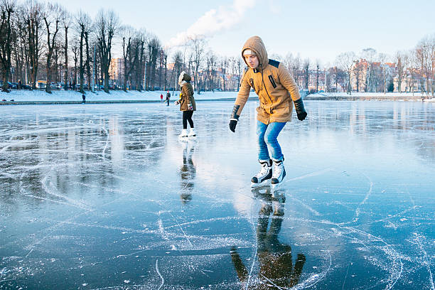 istock Ice skating on the frozen lake 638910598