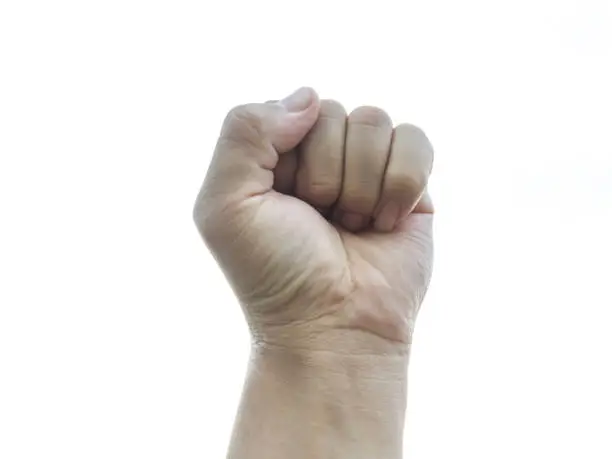 Photo of fist of male on isolated white background