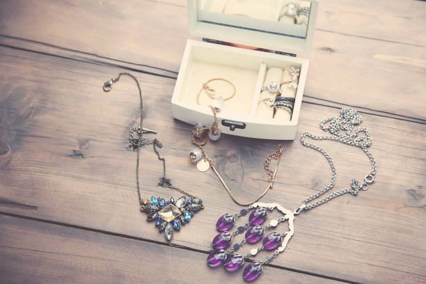 Necklaces and Boxes A collection of vintage jewelry in antique wooden jewelry box locket photos stock pictures, royalty-free photos & images