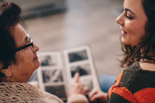 Granny showing her granddaughter memories from past