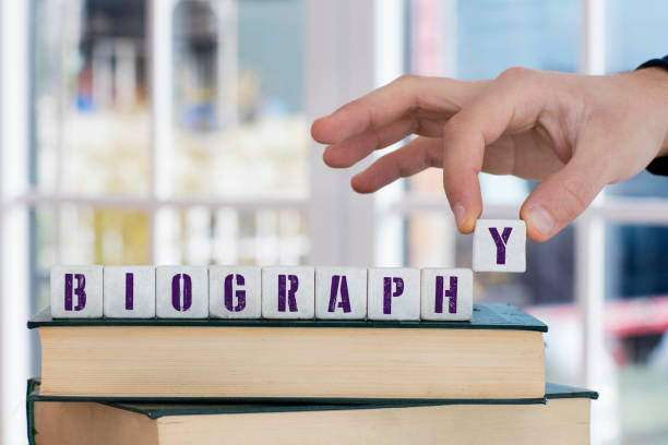 BIOGRAPHY Concept , Hand with alphabet blocks stock photo