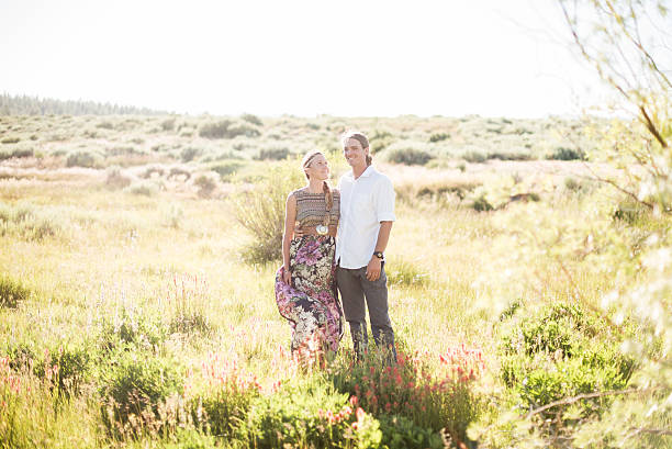 istock Couple in a meadow in love 638915298