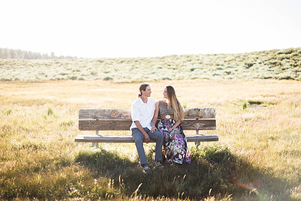 istock Young couple enjoy a rest in a meadow 638915412