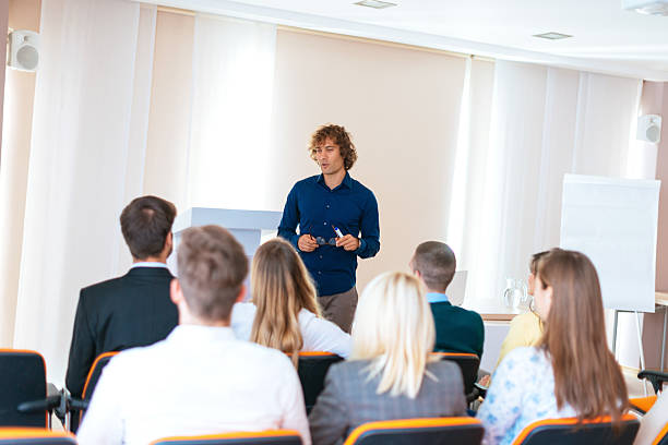 istock Lecturer debating with participants on seminar 638916008