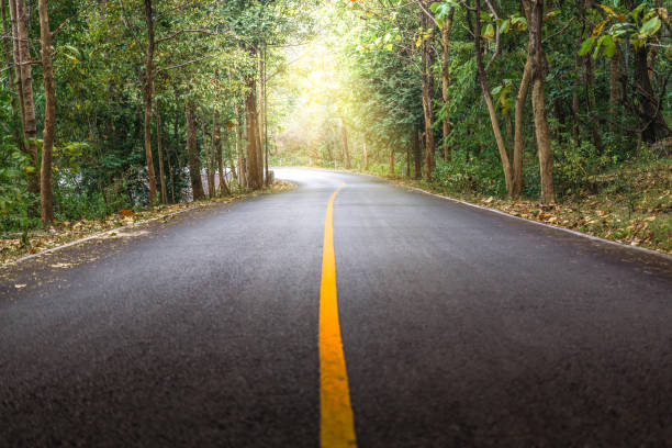 istock Rural road with a curve and sunlight at Mae Ya 638917650
