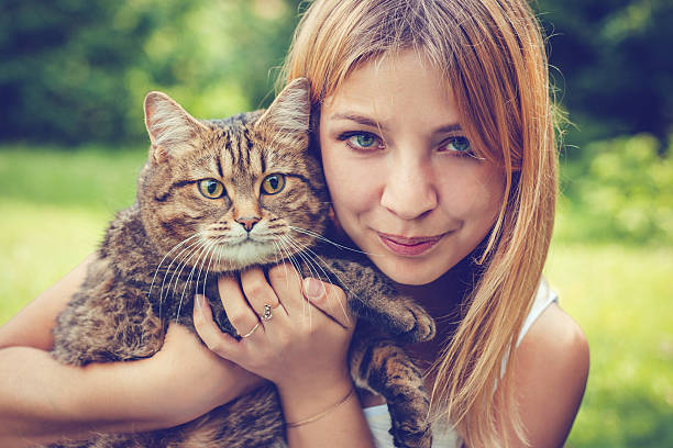 istock Young woman and her cat 638918872