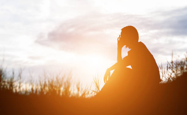 istock Sad and depressed woman sitting alone 638921658