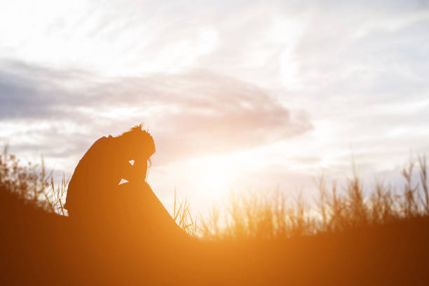 istock Sad and depressed woman sitting alone 638921666
