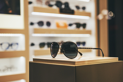 Elegant sunglasses in a fashion store showcase