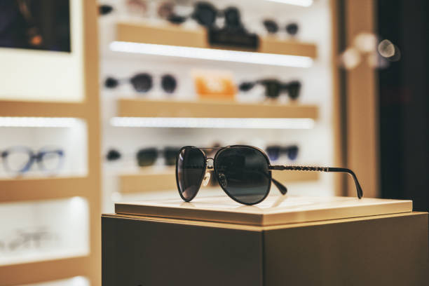 Elegant sunglasses in a fashion store showcase Elegant sunglasses in a fashion store showcase luxury eyewear stock pictures, royalty-free photos & images