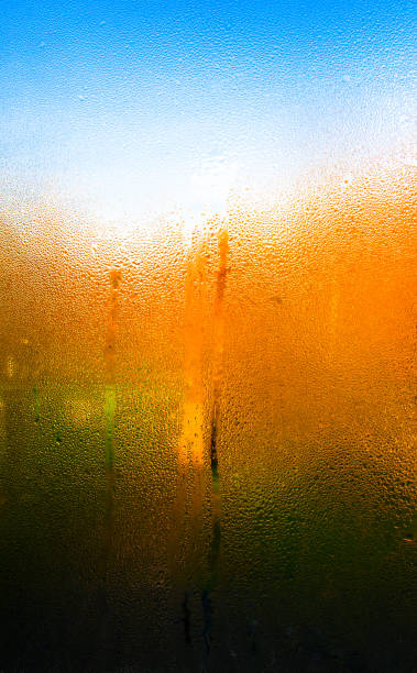 istock Vertical vivid rain drops tears on window 638923690