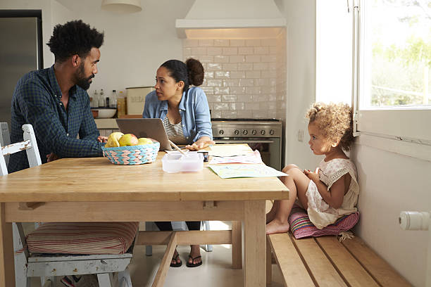istock Unhappy Girl Watching Parents Arguing In Kitchen 638923776