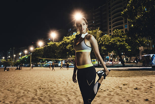 istock fit woman getting ready for workout at night 638924690