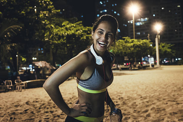 istock beautiful fit woman relaxing after workout 638925316