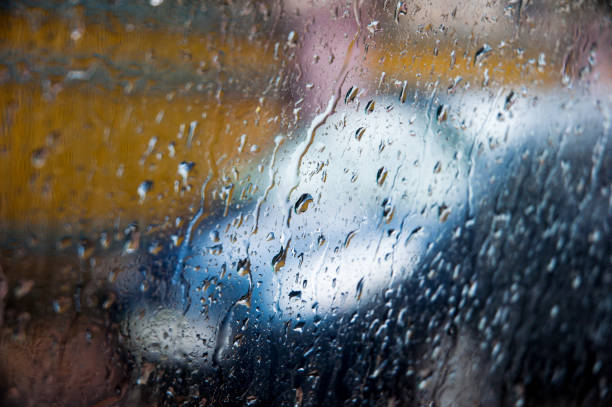 istock Car silhouette on a rainy day through rainy window 638926094