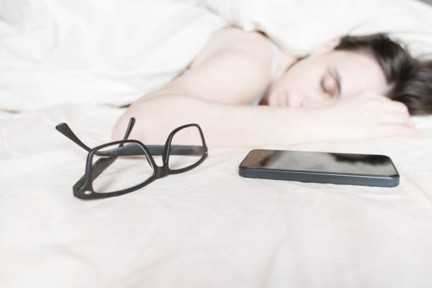 istock Tired young woman sleeping on bed 638928460