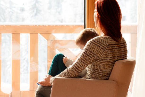 istock Mother and her son sitting in a chair with tablet. 638928802