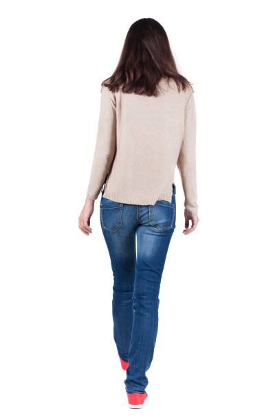 istock back view of walking  woman. 638928910