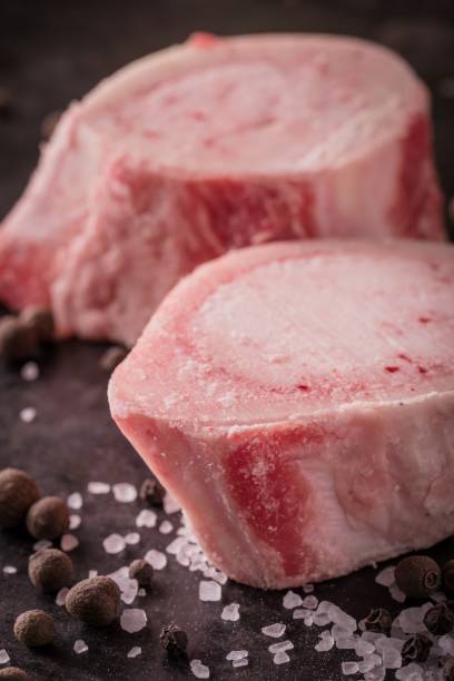 istock Two slices of marrowbone on dark board 638929028
