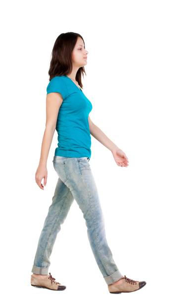 istock back view of walking  woman in jeans . 638929222