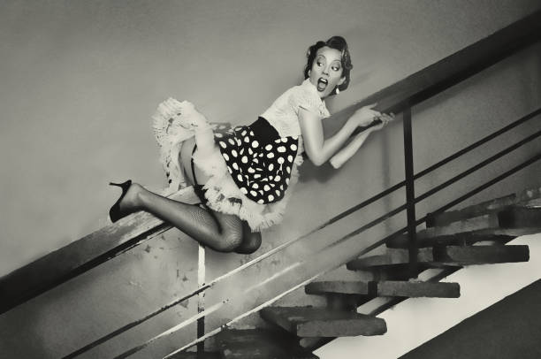 Girl goes down the banisters Girl goes down the banisters. Pin up style pin up girl photos stock pictures, royalty-free photos & images