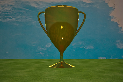 Golden cup under blue sky, 3d rendering