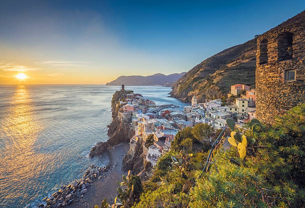 Vernazza at sunset, Cinque Terre National Park, Ligurian Riviera, Italy Photo of colorful fishing houses the fishing port of Vernazza at sunset, Cinque Terre World Heritage National Park, Ligurian Riviera, Italy liguria photos stock pictures, royalty-free photos & images