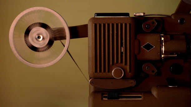 istock 8 mm projector running with vintage film 638936238