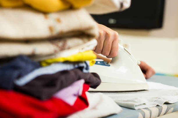 istock Close up of a hand ironing. 638942948