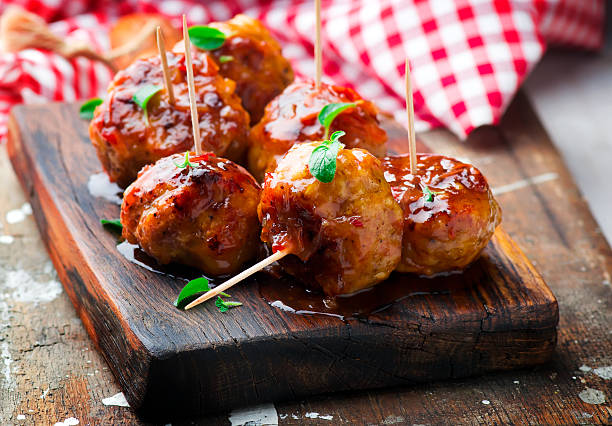 Chicken Meatballs with glaze Chicken Meatballs with glaze cocktail stick stock pictures, royalty-free photos & images