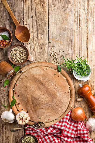 istock culinary background with empty cutting board, spices  and ingredients 638943462