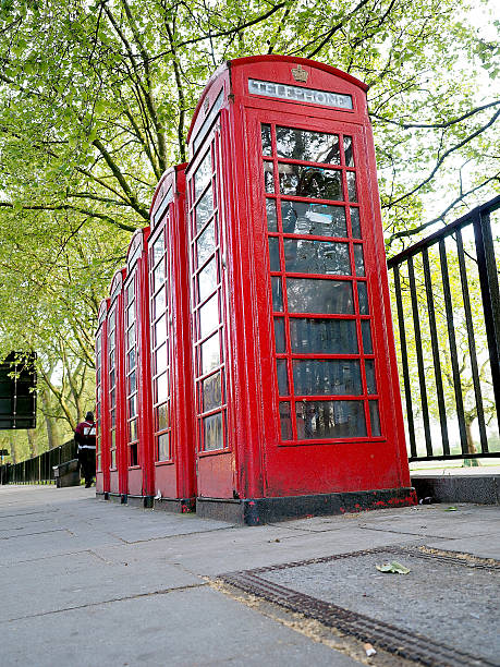 Row of old Red Phone boxes, Hyde Park, London London, England - April 28, 2014: Row of old Red Phone boxes, Hyde Park, London british telecom photos stock pictures, royalty-free photos & images