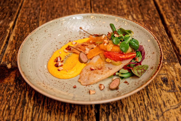 istock Seafood starter with orange slices and pumpkin mash 638948174