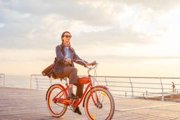 istock woman riding on seaside 638948224