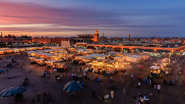 Aerial view of  Djemaa el Fna square, Marrakech, Morocco. Night view of Djemaa el Fna square, Marrakech, Morocco. Djemaa el Fna is a heart of Marrakesh's medina quarter.http://bem.2be.pl/IS/morocco_380.jpg marrakesh riad stock pictures, royalty-free photos & images