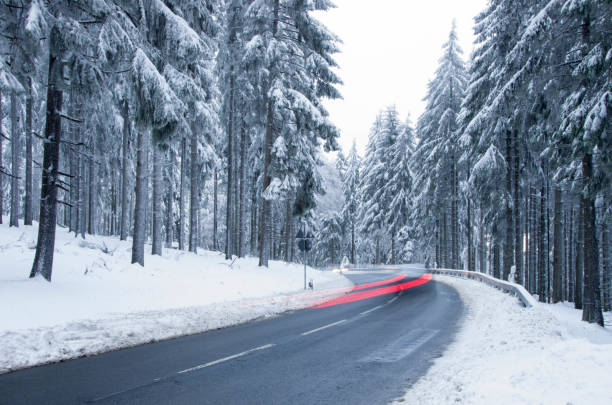 istock Car moving through a snow covered road in mountain 638948784