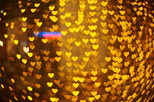 istock Abstract orange bokeh in a form of heart 638949028