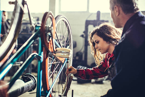 istock Mentor showing her worker how to do repair... 638949494