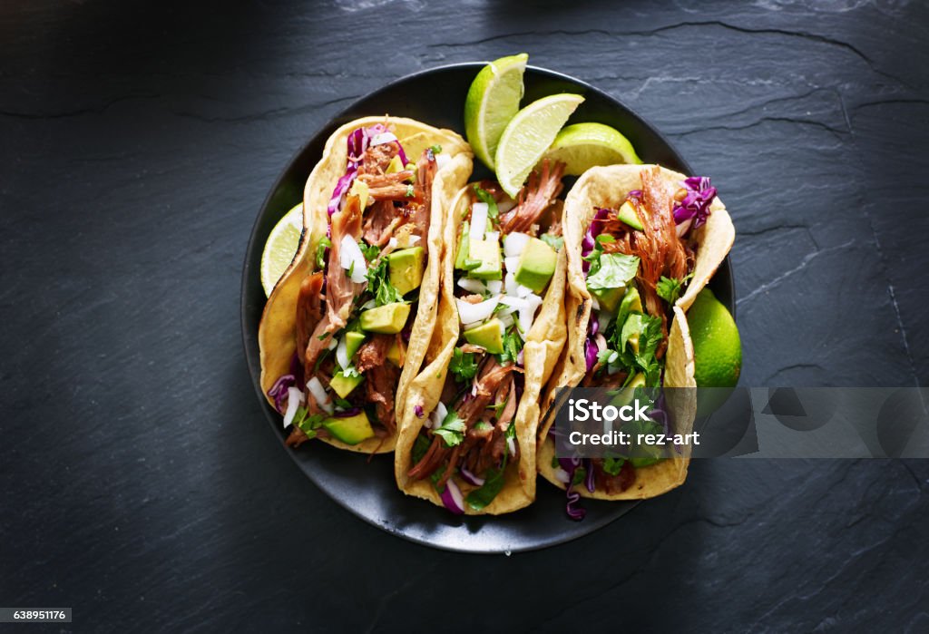 mexican street tacos flat lay composition mexican street tacos flat lay composition with pork carnitas, avocado, onion, cilantro, and red cabbage Taco Stock Photo